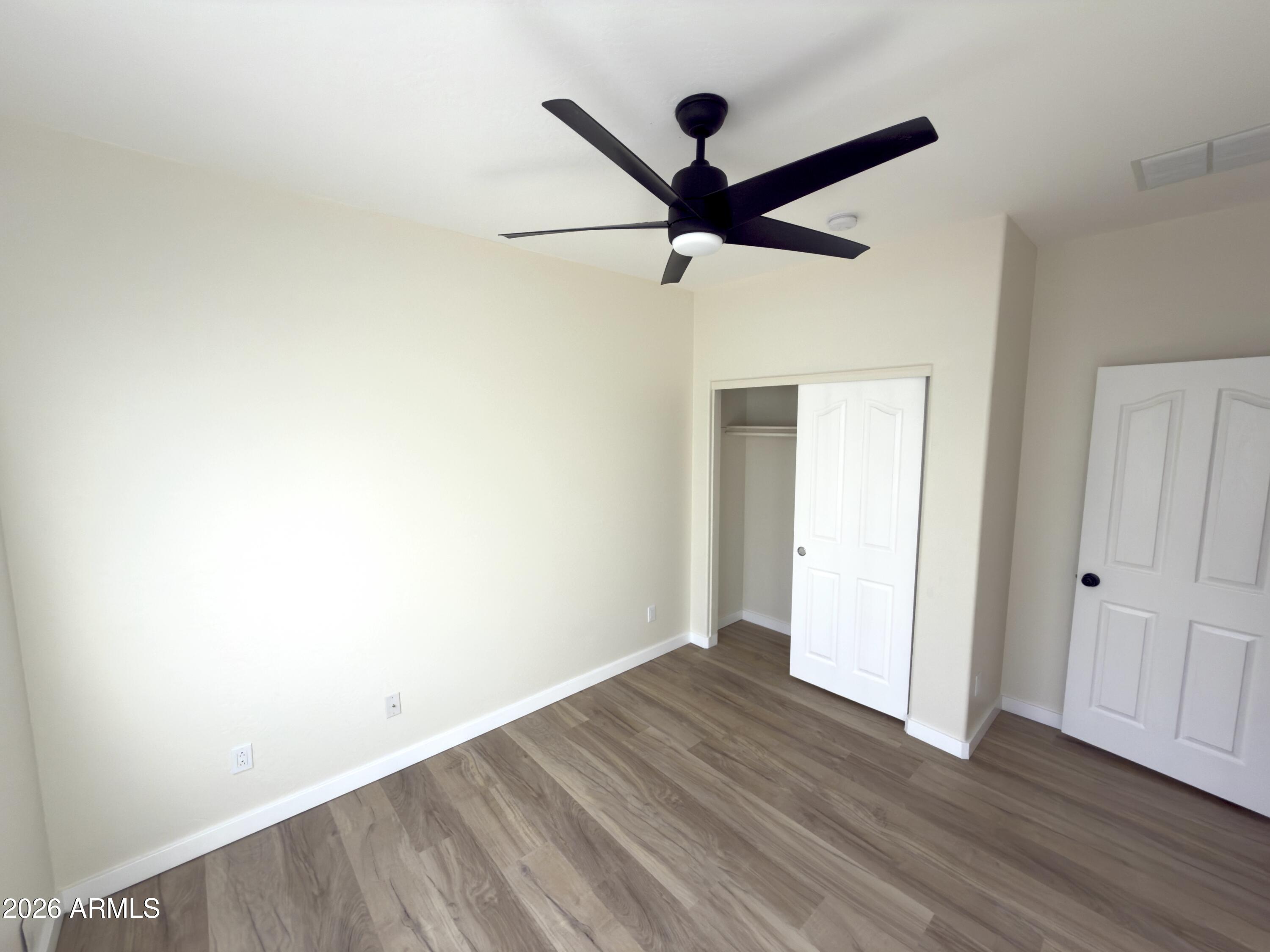 5319 West Coles Road Laveen, AZ 85339 - Photo 18 of 20 wooden floor in an empty room