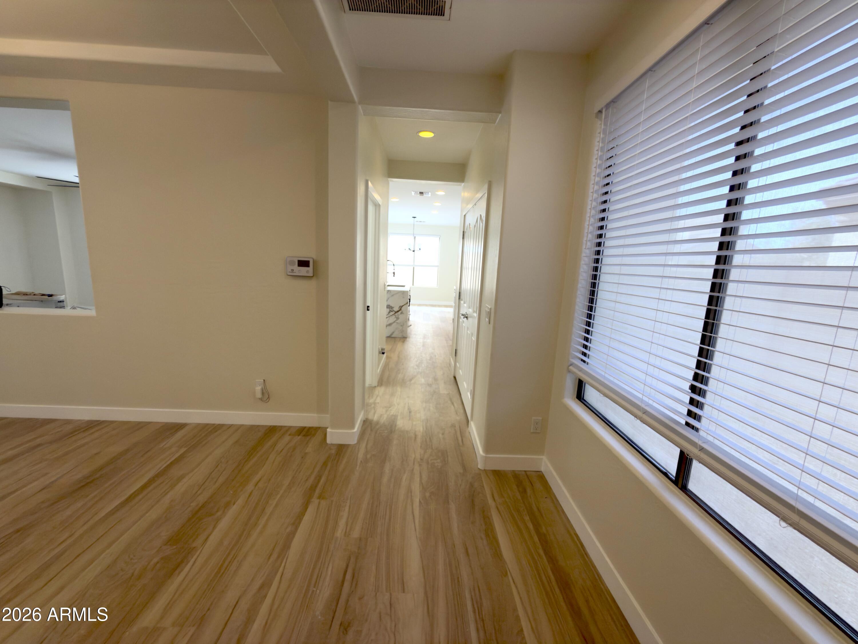 5319 West Coles Road Laveen, AZ 85339 - Photo 10 of 20 a view of a room with wooden floor