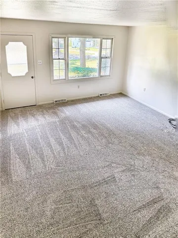 a view of a utility room with windows