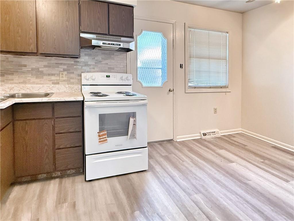 1600 Ohio Avenue, Unit 4 Industry, PA 15052 - Photo 5 of 20 a kitchen with granite countertop white cabinets and white appliances