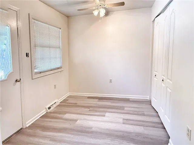 a kitchen with a refrigerator stove and cabinets