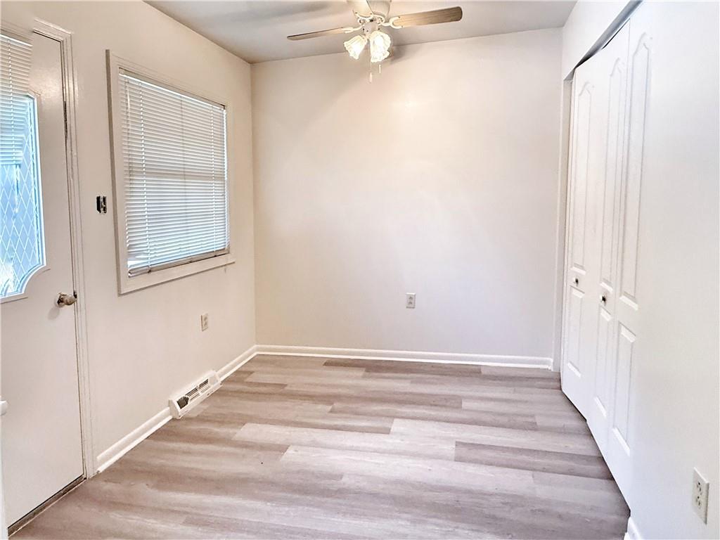 1600 Ohio Avenue, Unit 4 Industry, PA 15052 - Photo 7 of 20 a view of an empty room with wooden floor and a window