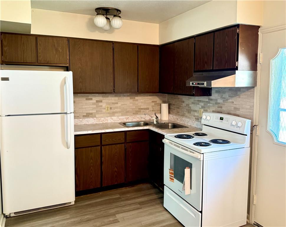 1600 Ohio Avenue, Unit 4 Industry, PA 15052 - Photo 8 of 20 a kitchen with a refrigerator stove and cabinets