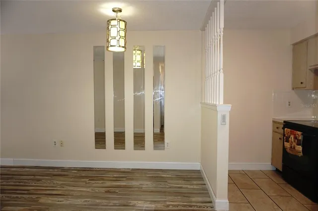 a view of a livingroom with wooden floor and a window