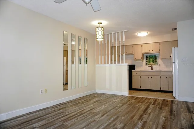 a view of a bathroom with a sink and mirror