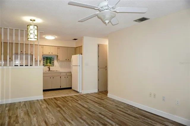 a view of a kitchen with a sink and cabinets