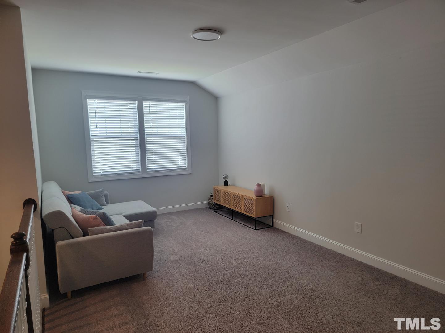 105 Winding Creek Loop Chapel Hill, NC 27517 - Photo 15 of 47 a living room with furniture and a window