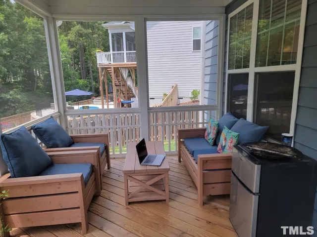 a outdoor living space with patio furniture and garden view
