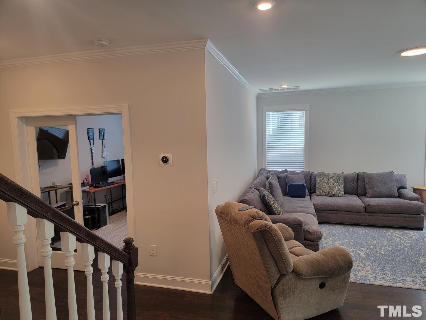 105 Winding Creek Loop Chapel Hill, NC 27517 - Photo 23 of 47 a living room with furniture and a window