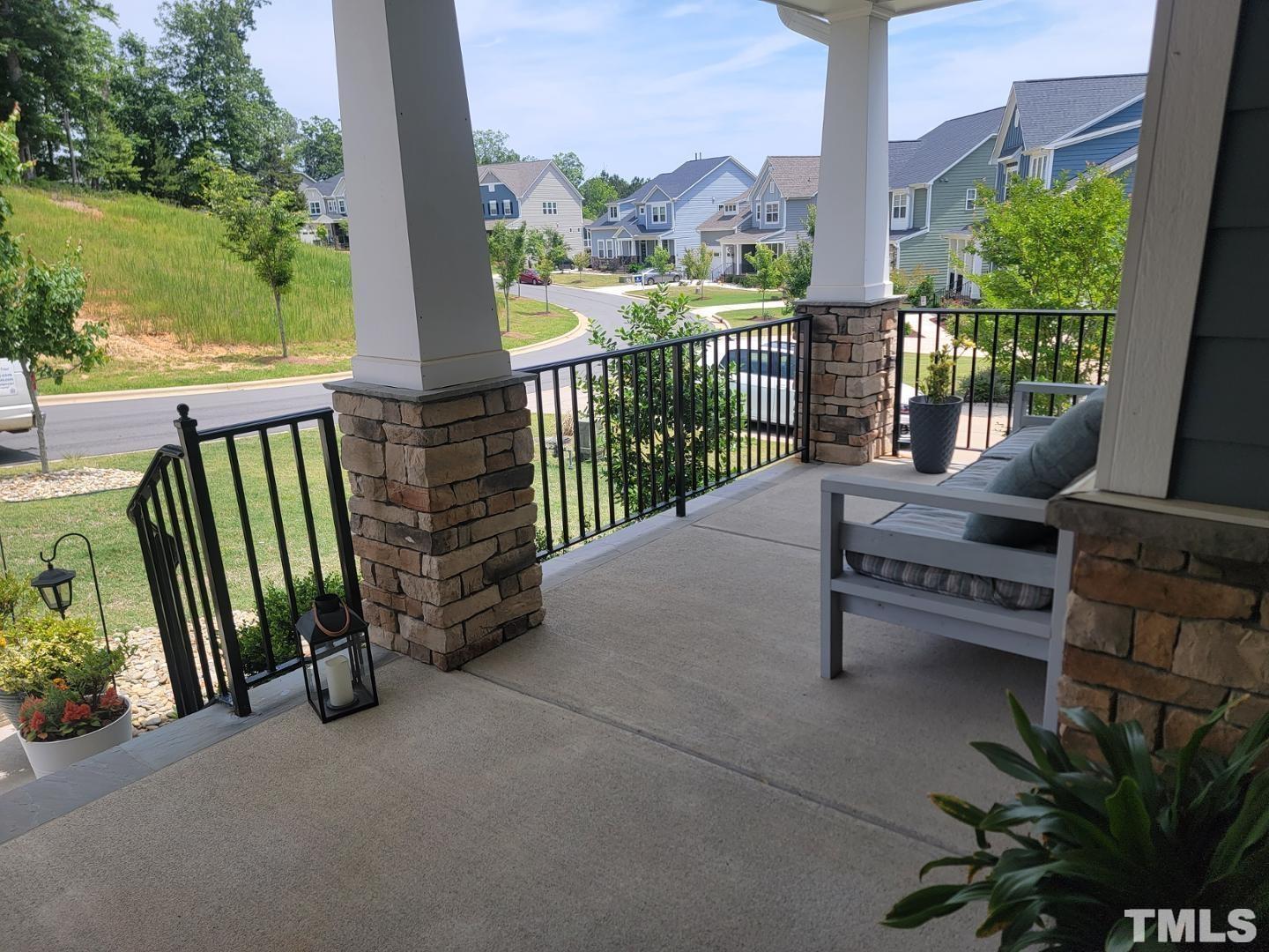 105 Winding Creek Loop Chapel Hill, NC 27517 - Photo 26 of 47 a view of a balcony with floor to ceiling windows and wooden fence