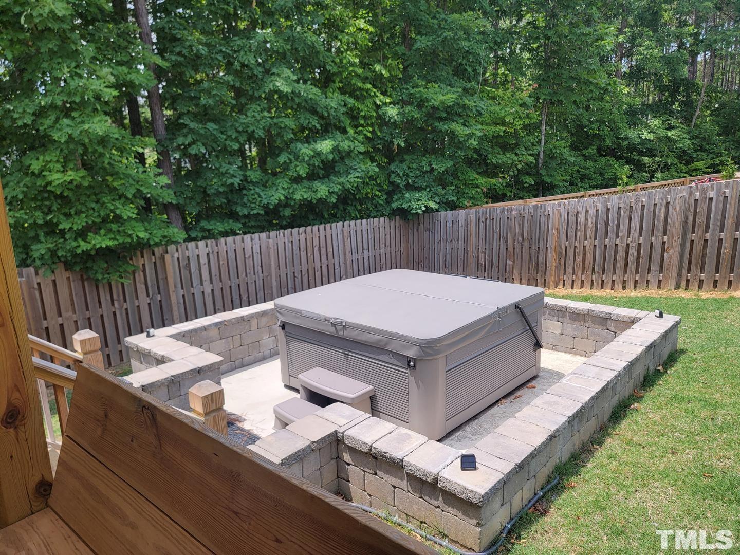 105 Winding Creek Loop Chapel Hill, NC 27517 - Photo 27 of 47 a view of a dinning table and chairs in the back yard
