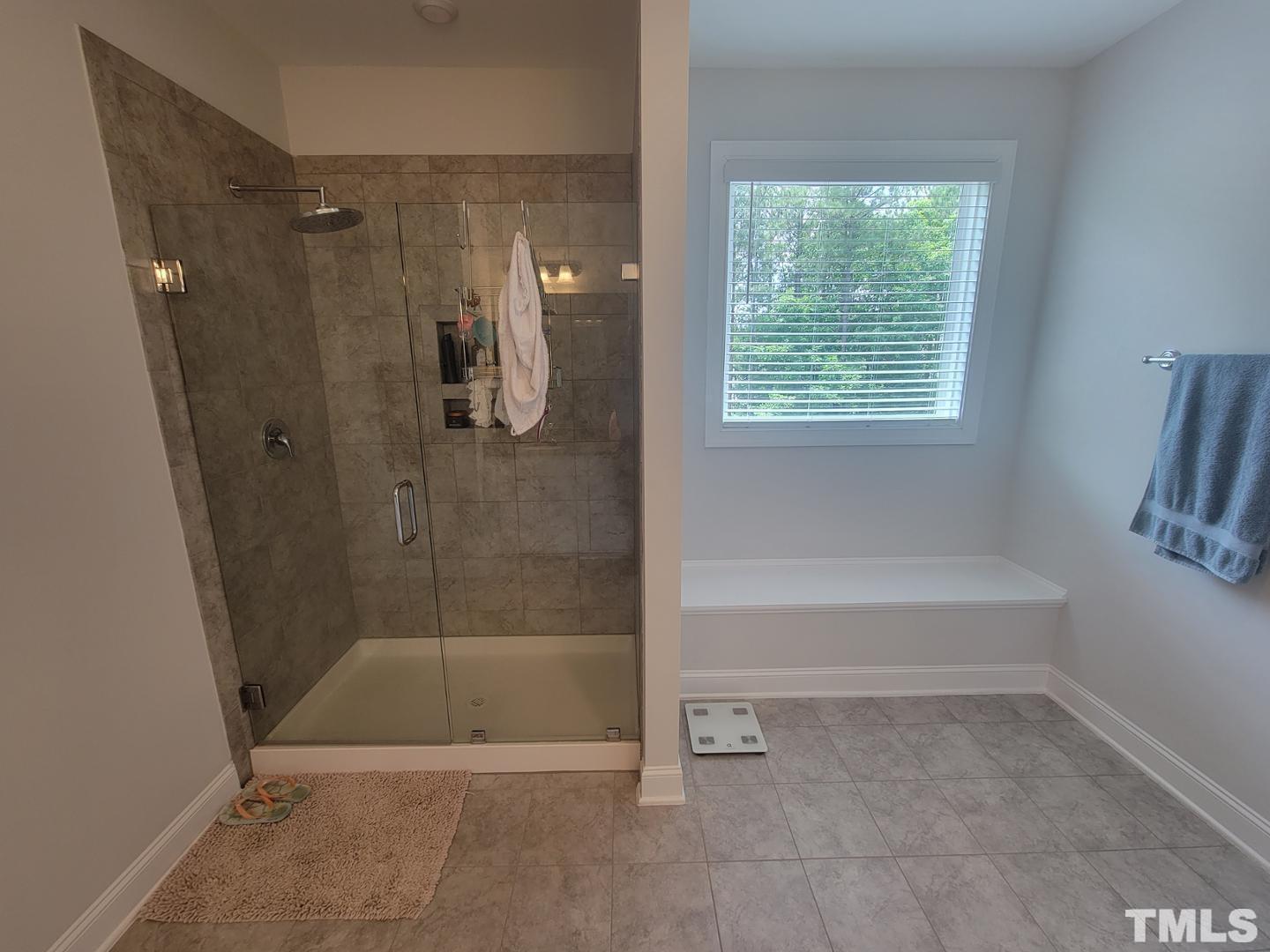 105 Winding Creek Loop Chapel Hill, NC 27517 - Photo 34 of 47 a bathroom with a bath tub and a shower