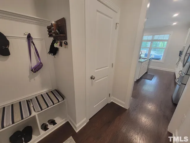 a view of an entryway with wooden floor