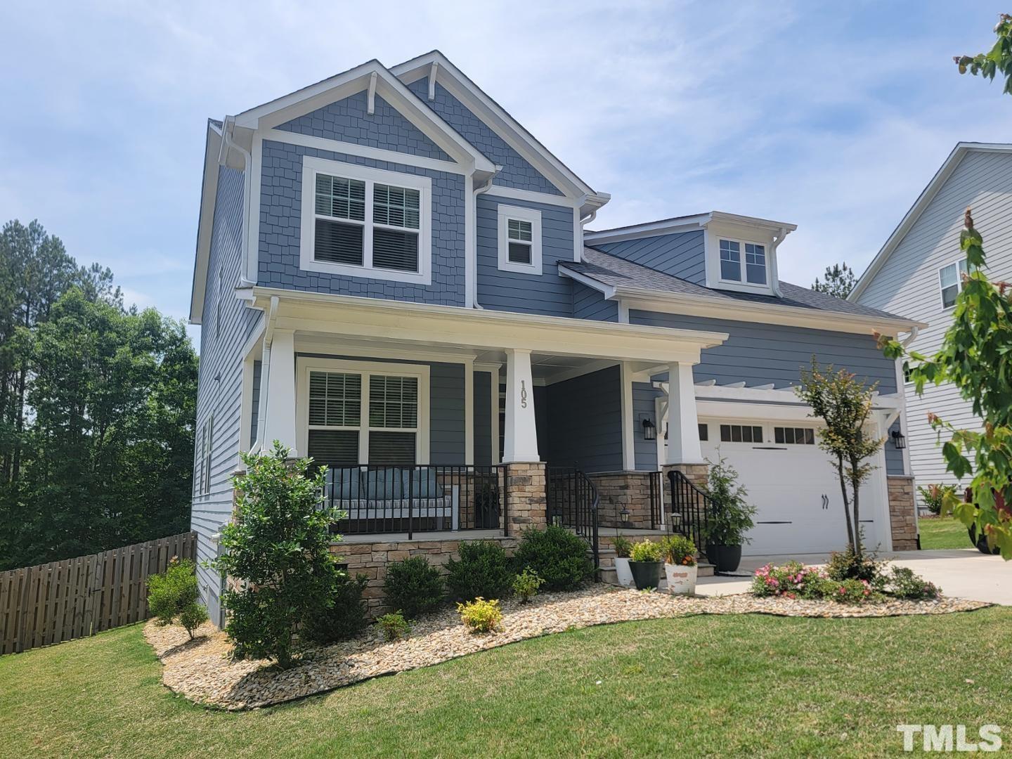 105 Winding Creek Loop Chapel Hill, NC 27517 - Photo 42 of 47 a front view of a house with a yard