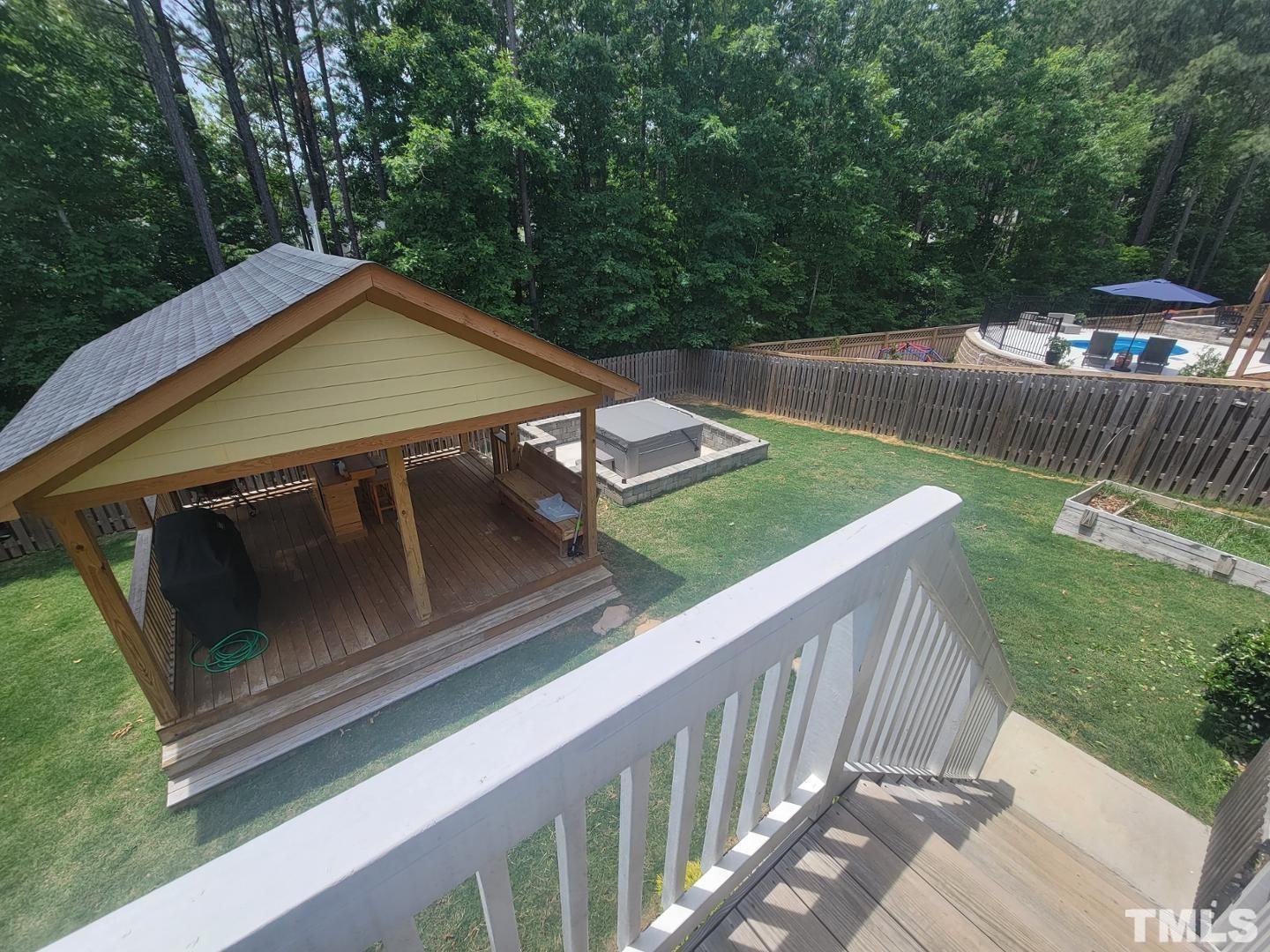 105 Winding Creek Loop Chapel Hill, NC 27517 - Photo 44 of 47 a view of a wooden deck and a yard