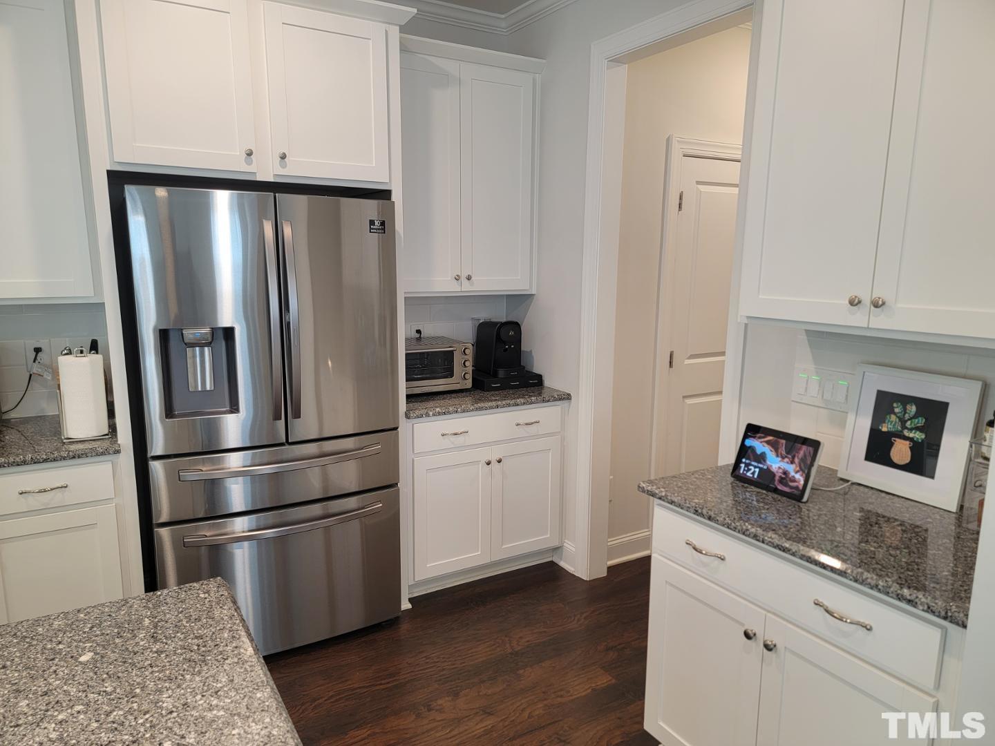 105 Winding Creek Loop Chapel Hill, NC 27517 - Photo 8 of 47 a kitchen with appliances a refrigerator and cabinets