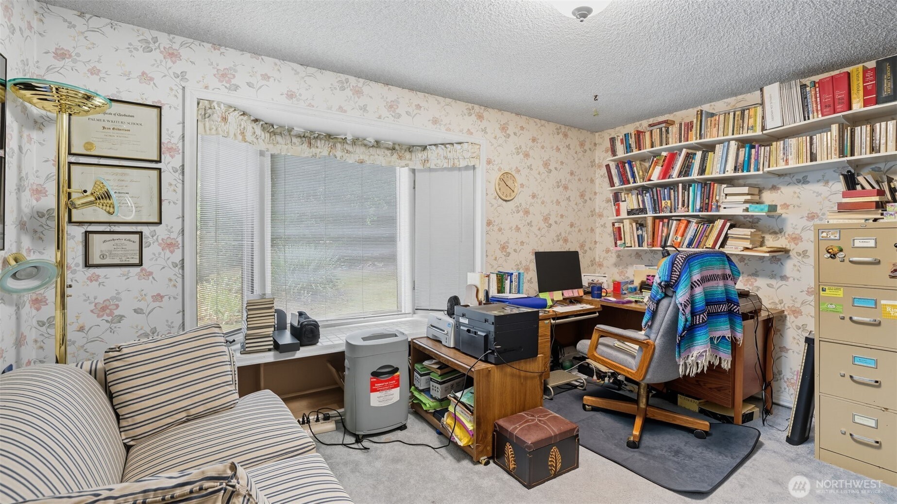 2001 Camas Court Southeast Renton, WA 98055 - Photo 24 of 29 a view of a workspace with furniture and a bookshelf