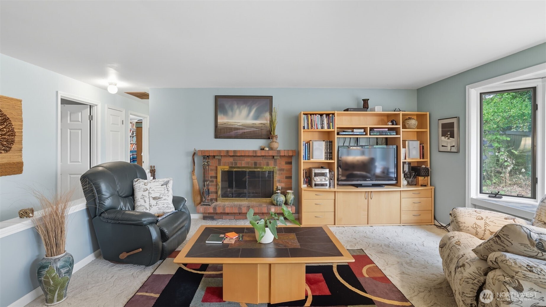 2001 Camas Court Southeast Renton, WA 98055 - Photo 8 of 29 a living room with furniture and a fireplace