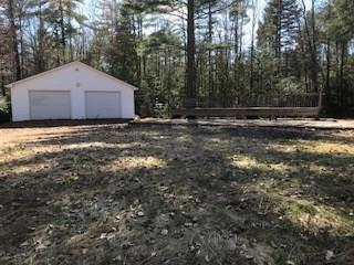 64 Medford Road Lagrange, ME 04453 - Photo 2 of 3 Garage and deck and slab to right