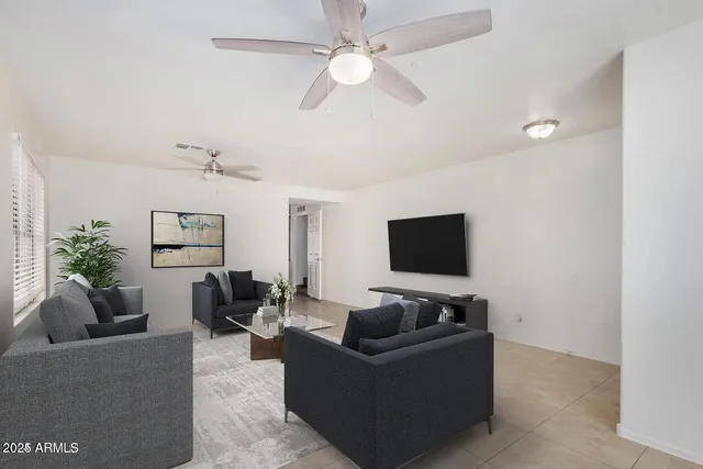 a living room with furniture and a flat screen tv