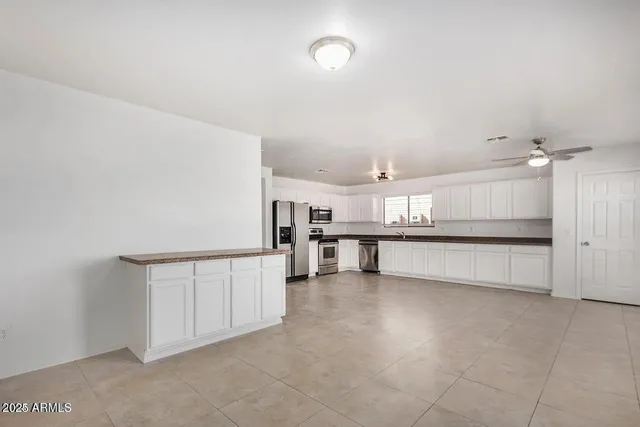 a view of a kitchen with a sink