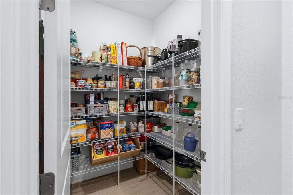 9268 Tequila Sunrise Drive Sarasota, FL 34241 - Photo 17 of 56 a shelf with books and knick knacks on it