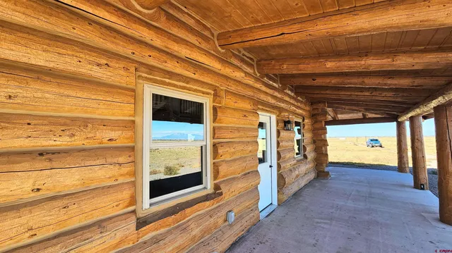 a view of entryway with wooden floor and stairs