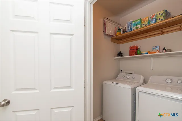 a utility room with dryer and washer