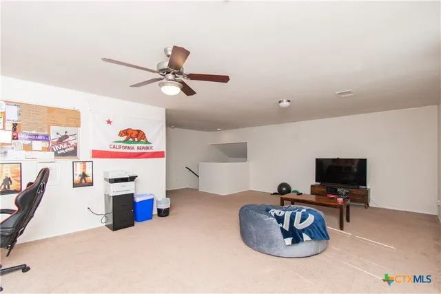 a room with furniture and a flat screen tv