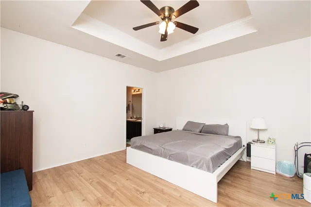 a bedroom with a bed and a dresser