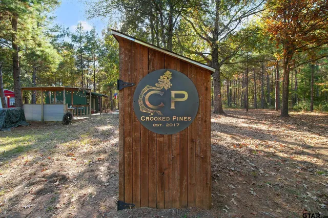 a sign broad in front of a yard