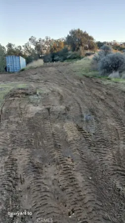 a view of a dry yard with mountain