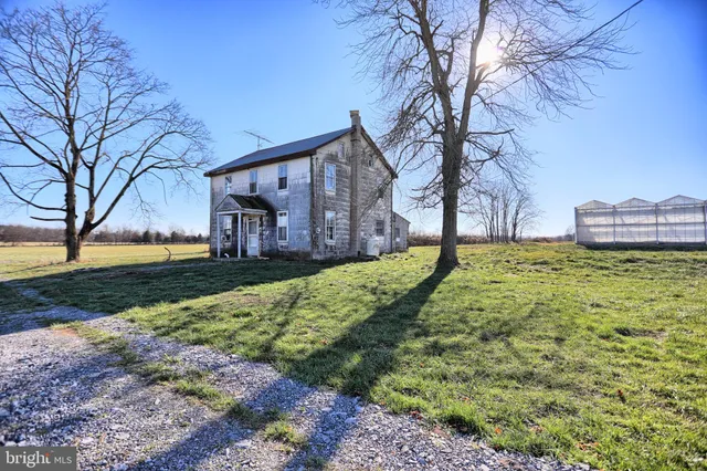 an aerial view of a house with a lake view