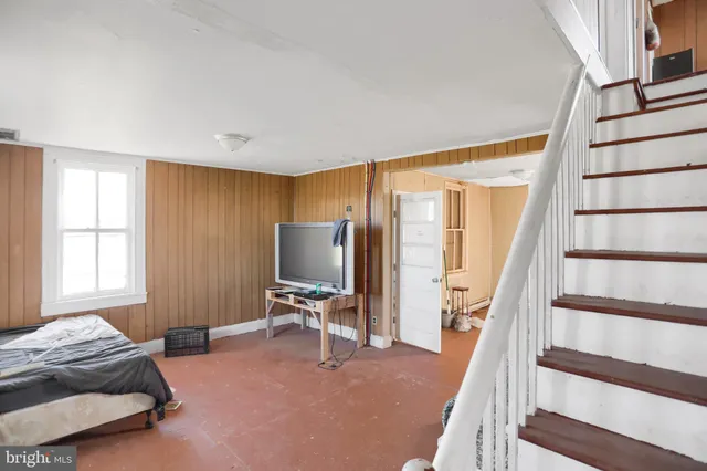 a view of a house with a backyard and a garage