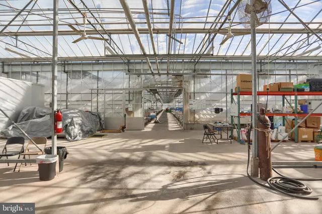 a view of a balcony with a car parked on the road