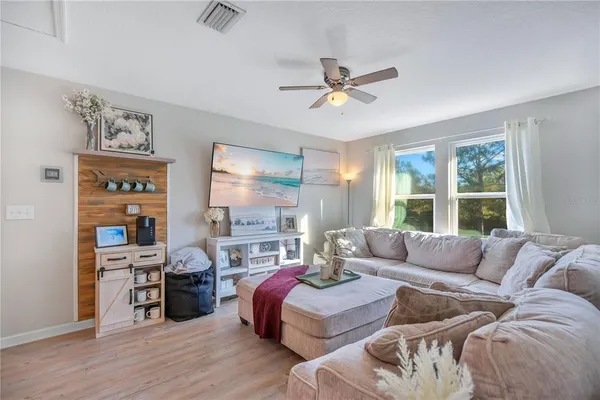 a living room with furniture and a window