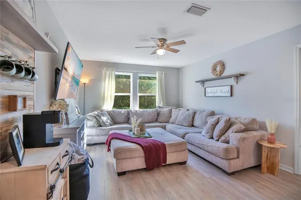 a living room with furniture and a window