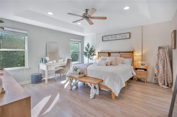 a bed room with a bed and a chair