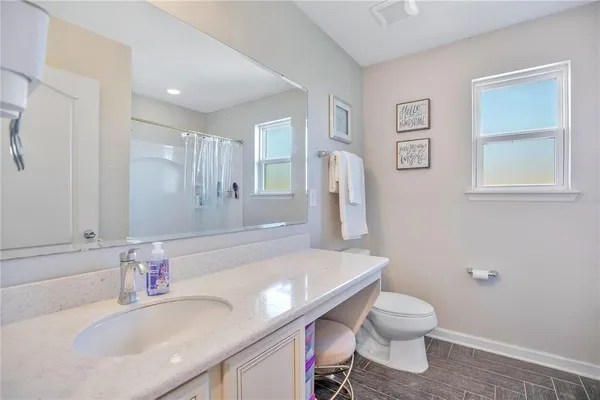 a bathroom with a sink a toilet and a bathtub