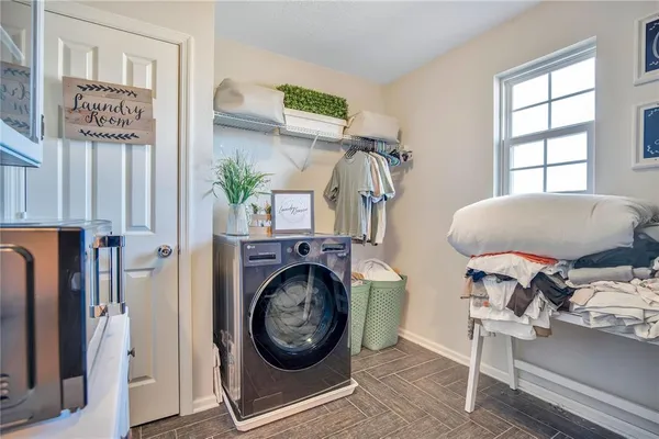 a living room with furniture a window and a fireplace