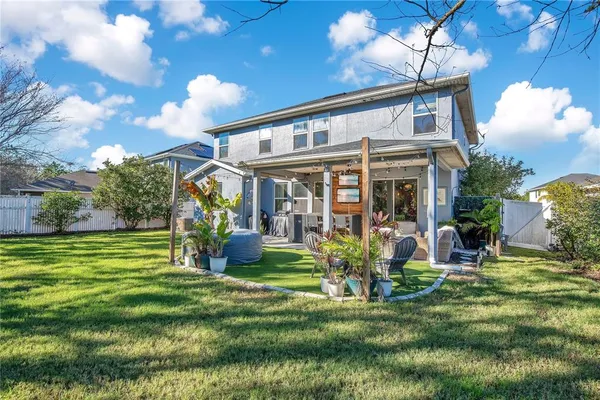 a view of a house with a yard porch and sitting area