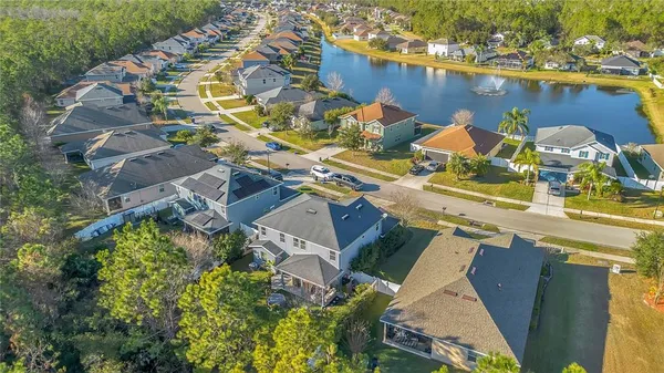 an aerial view of a house with a lake view