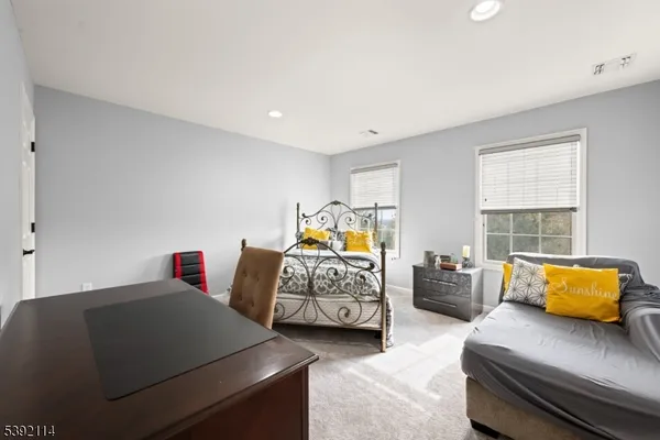 a bedroom with furniture and window