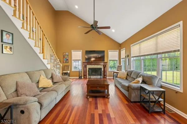 a living room with furniture fireplace and a flat screen tv