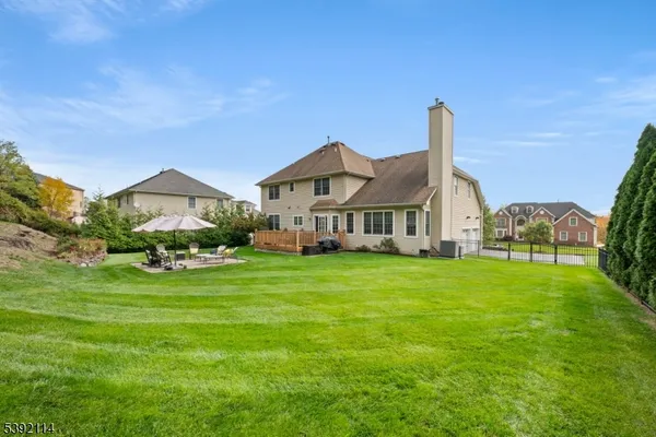 a aerial view of a house with a swimming pool yard and outdoor seating