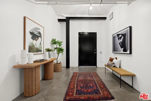 a bedroom with a bed and a table