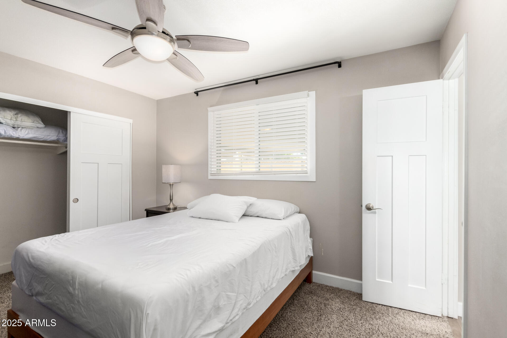 2100 North Normal Avenue Tempe, AZ 85288 - Photo 16 of 51 a bedroom with a bed and a chandelier