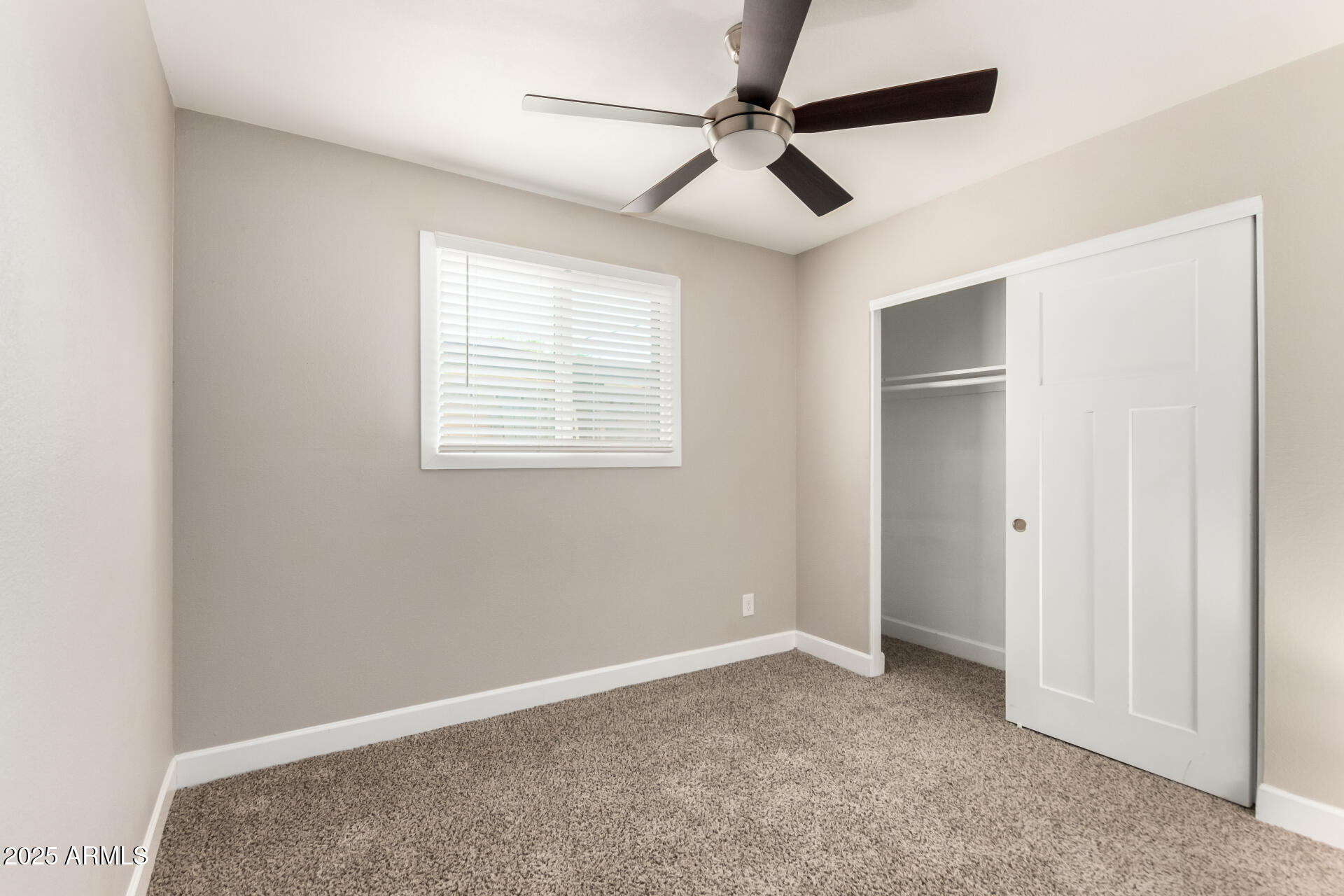 2100 North Normal Avenue Tempe, AZ 85288 - Photo 23 of 51 a view of a livingroom with a ceiling fan and window