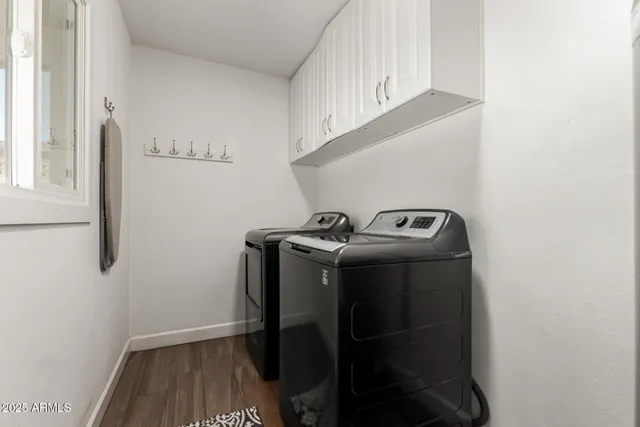 a utility room with dryer and washer