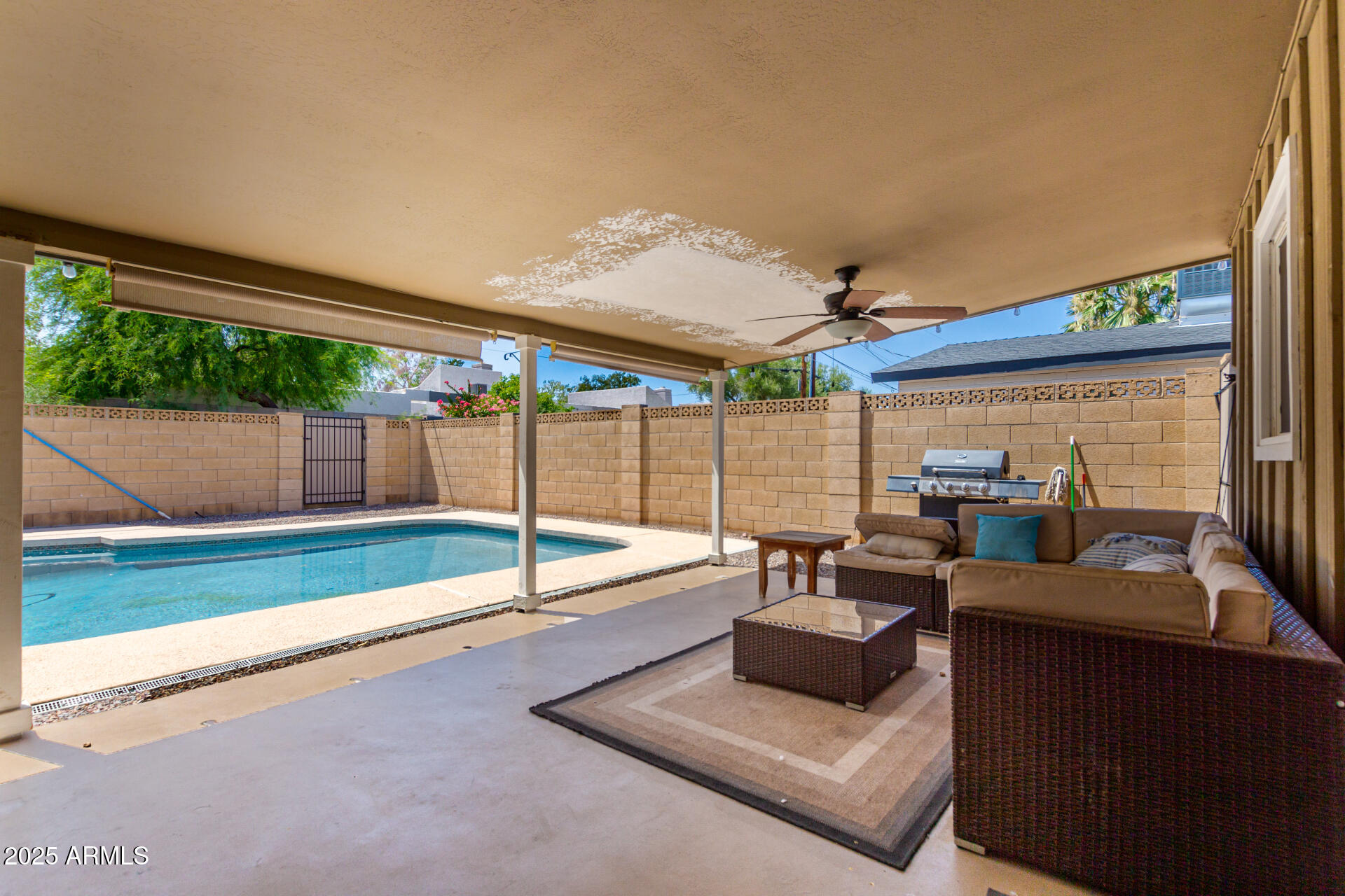 2100 North Normal Avenue Tempe, AZ 85288 - Photo 27 of 51 a living room with couch and a floor to ceiling window